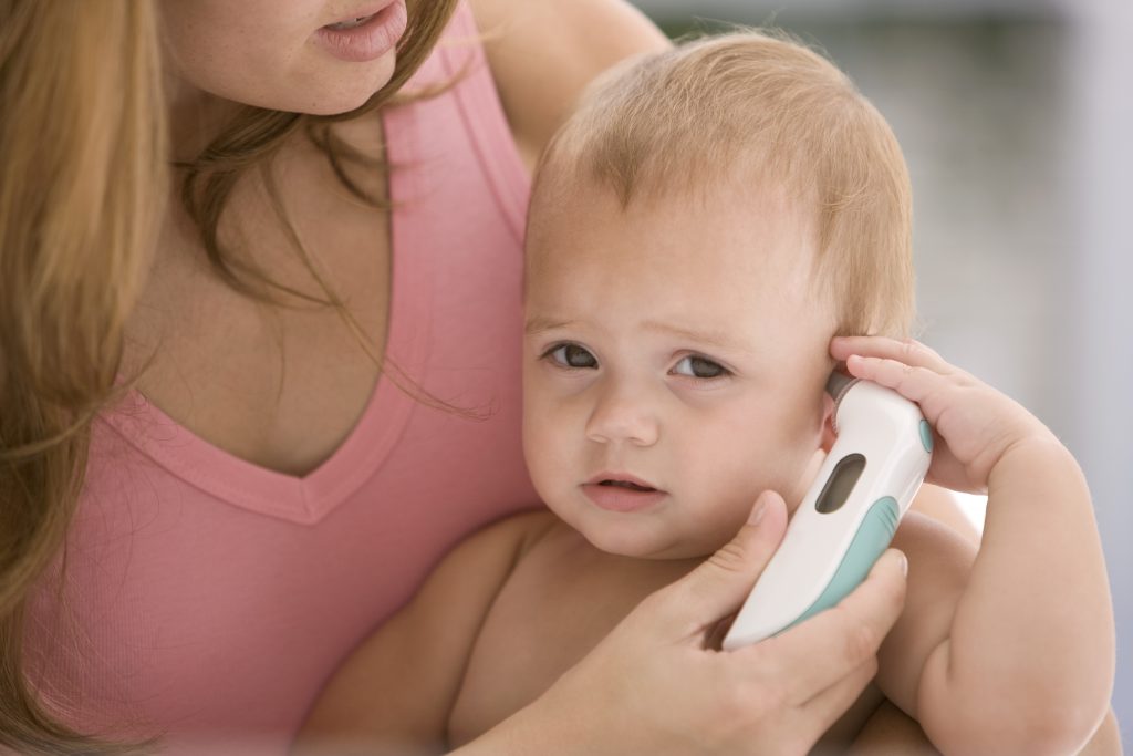 mum checking baby's temperature
