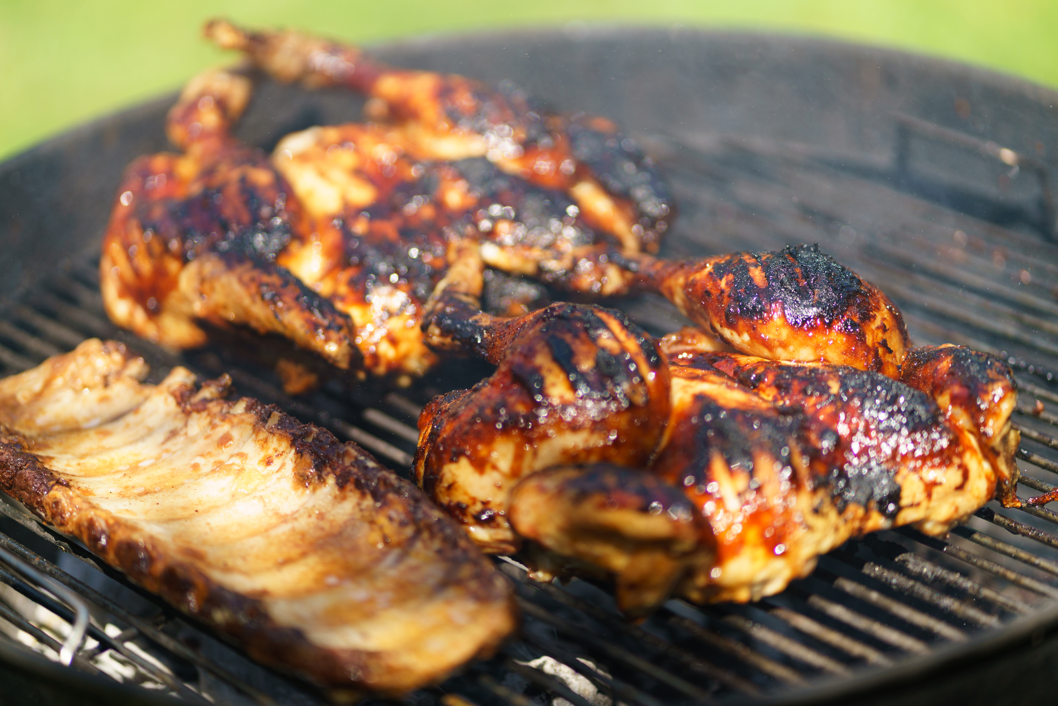 Chicken cooking on a BBQ