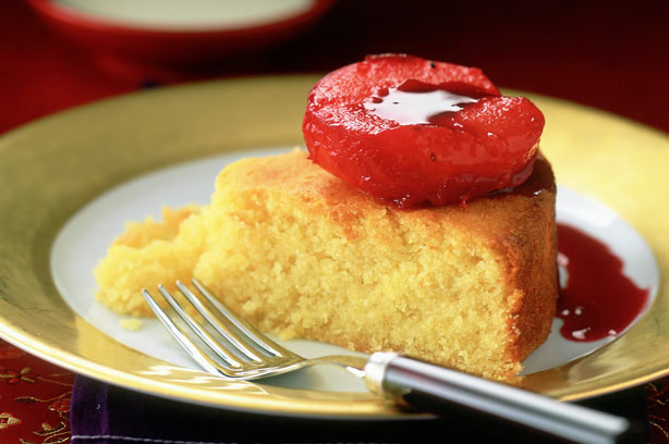 Almond pudding with poached plums