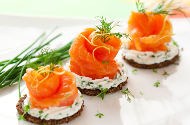 Smoked salmon roses on rye toast