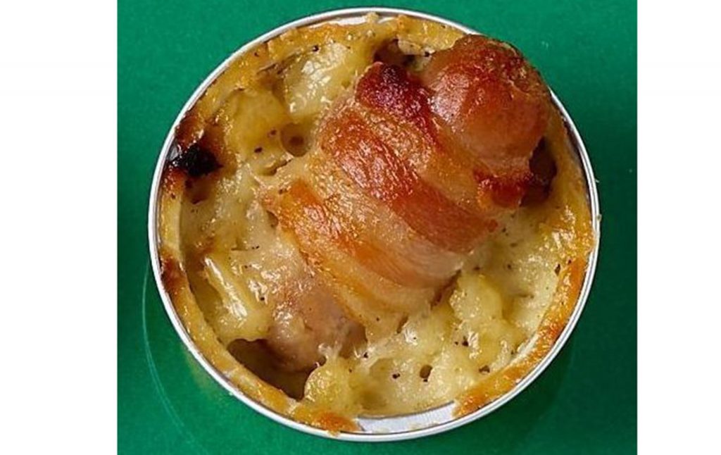 Coop lanches baked mac and cheese topped with pigs in blankets