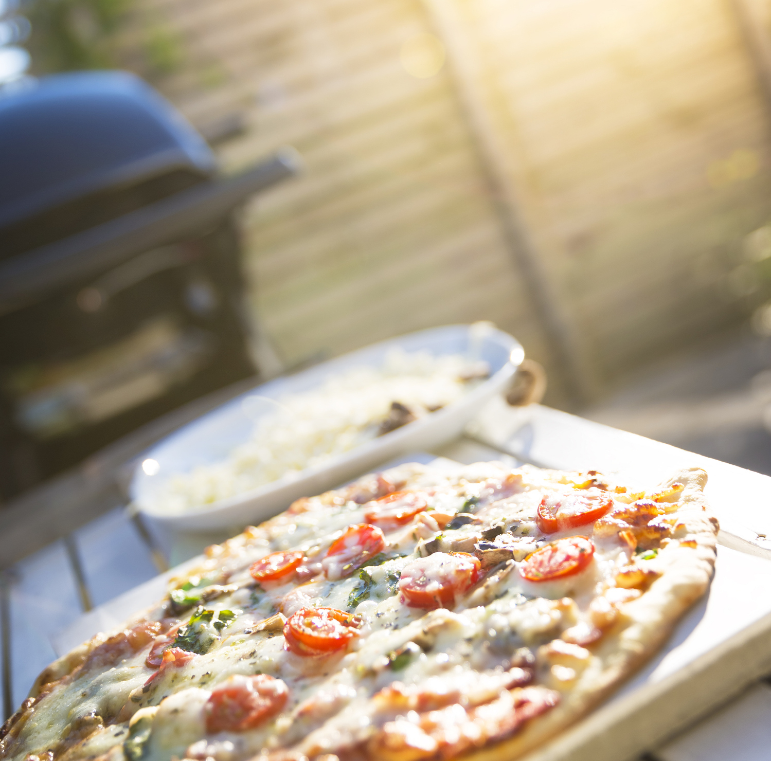 Pizza that has been cooked on a BBQ.