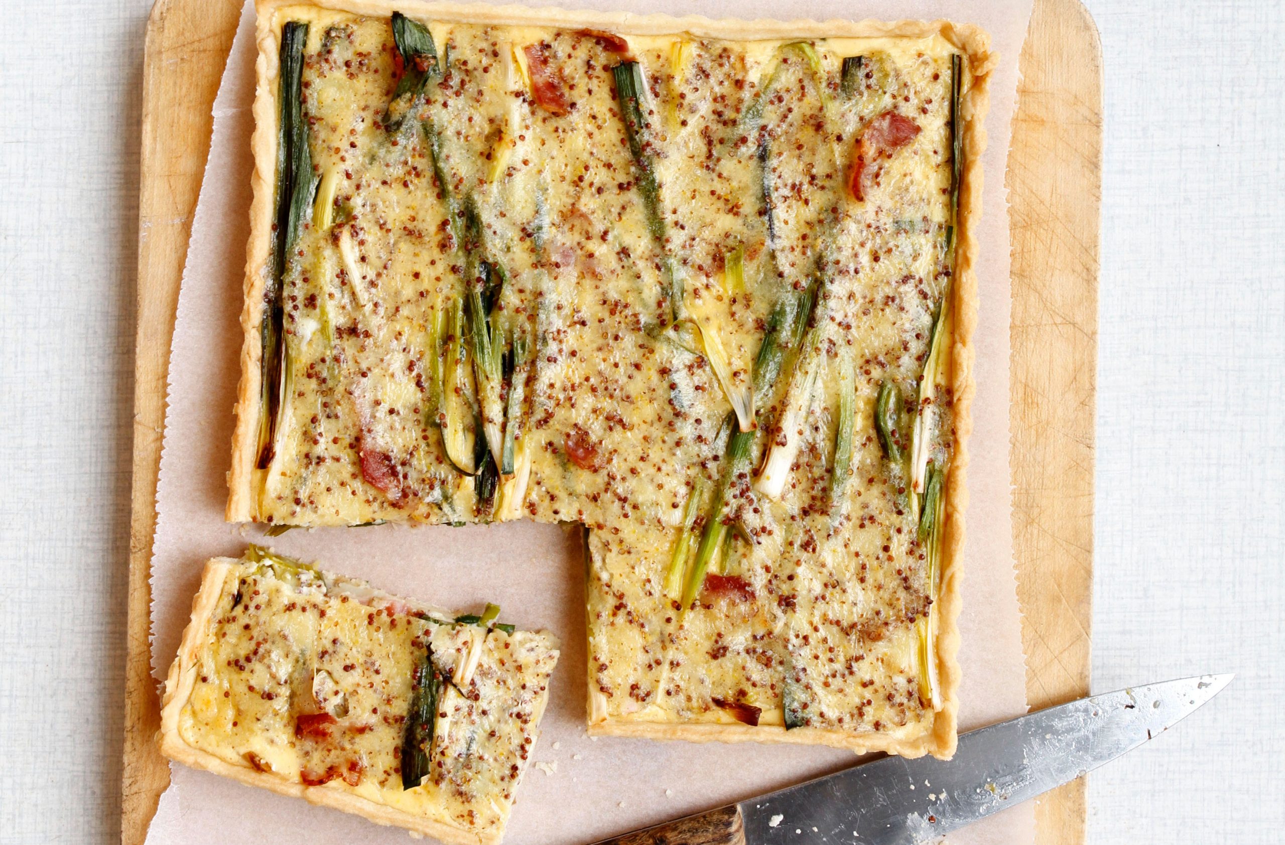 Smoky cheese, bacon, baby leek and potato tart