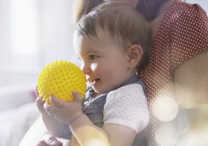 baby playing with a ball