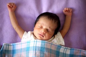 baby sleeping with arms up - baby sleep training