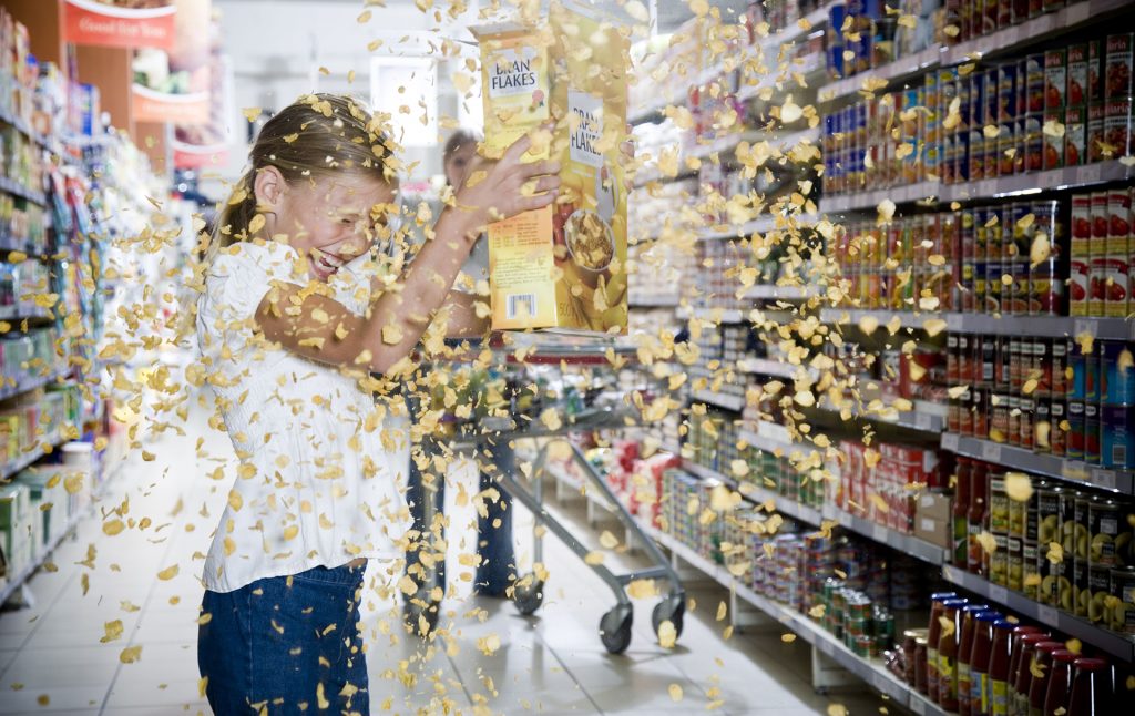 girl emptying cereal
