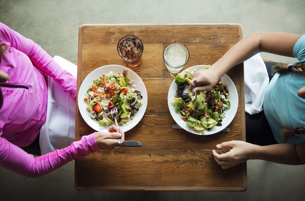 women cutting entire food groups