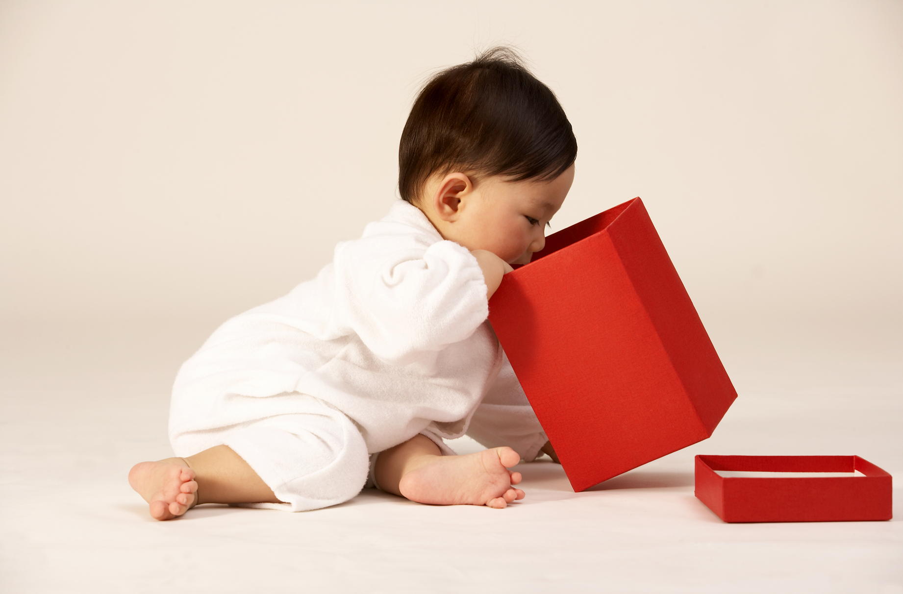 Why babies love putting things in boxes and tipping them out
