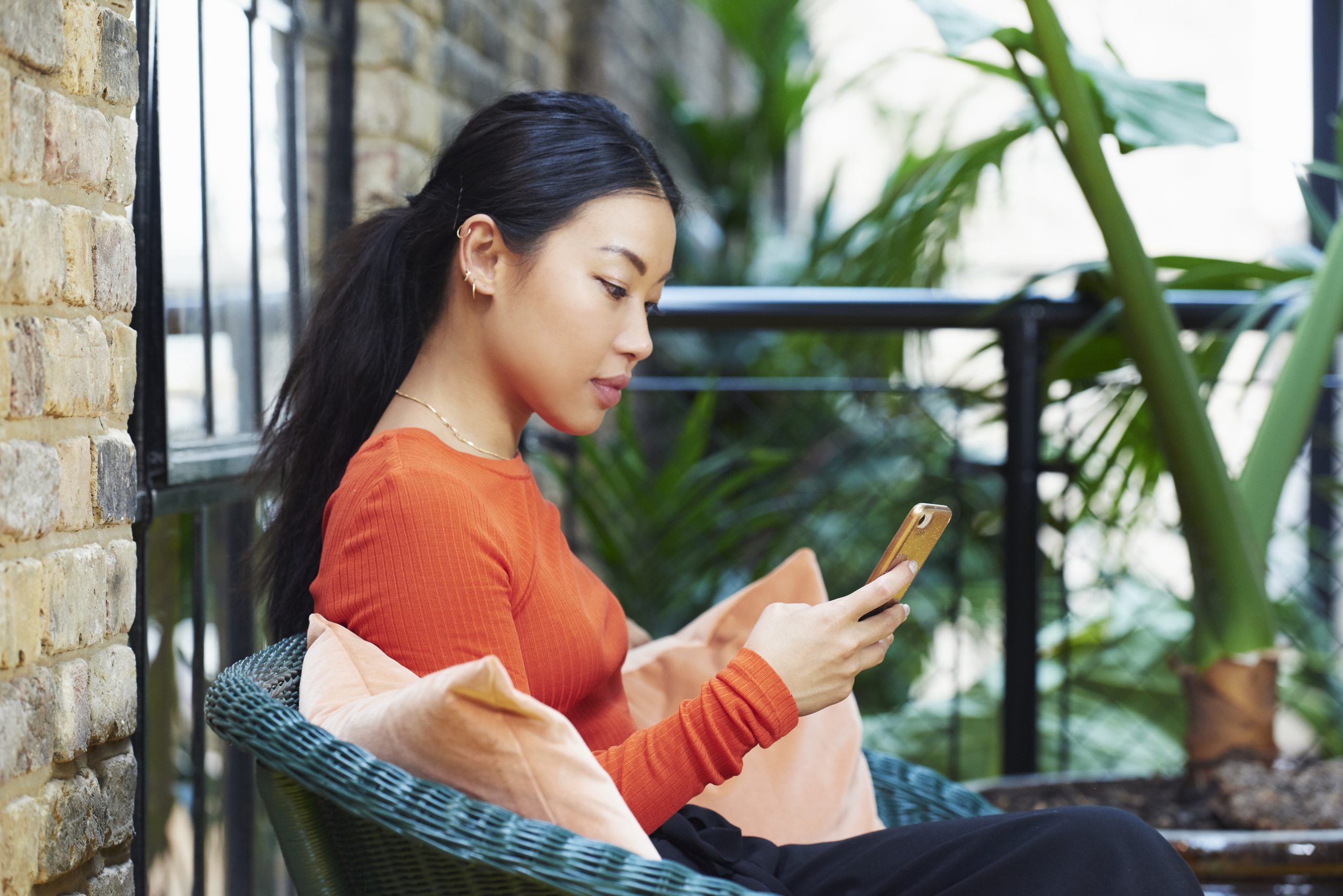 woman looking at her phone