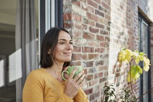 woman looking out of doorway