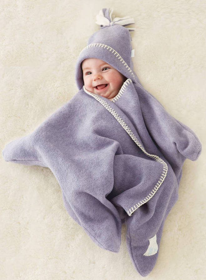 Baby in a star wrap fleece given as a baby shower gift