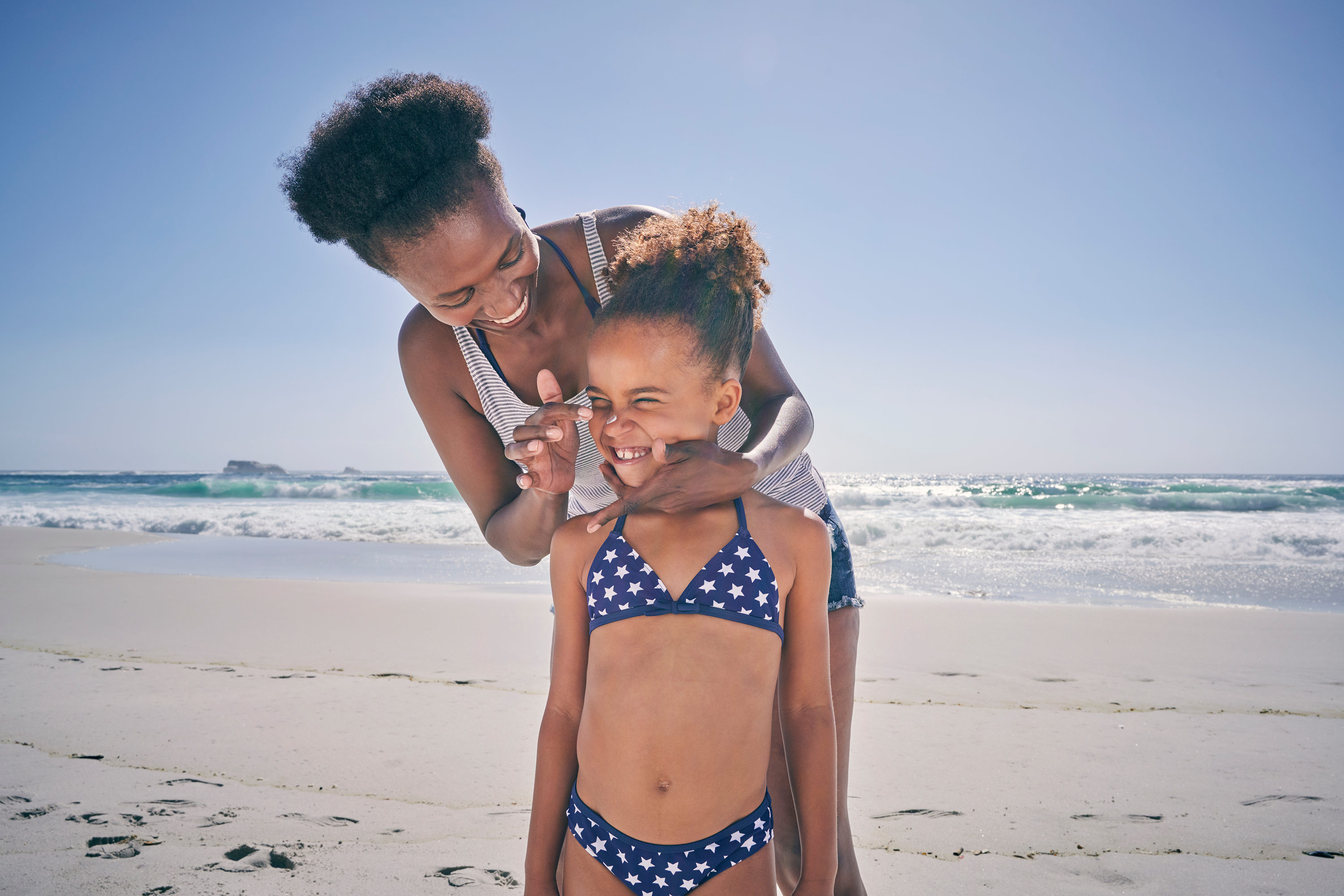 mother and daughter on beach - uses of sudocrem