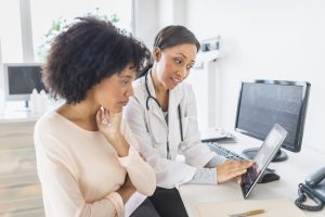 woman talking to doctor