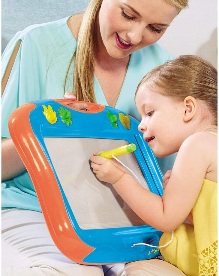 Mother and daughter playing with megasketcher magnetic drawing board