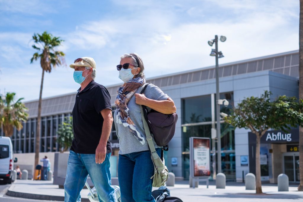 A man and a woman arriving abroad on holiday from the UK