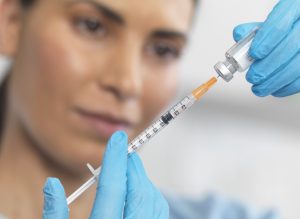 picture of syringe and vaccine - covid-19 vaccine volunteers