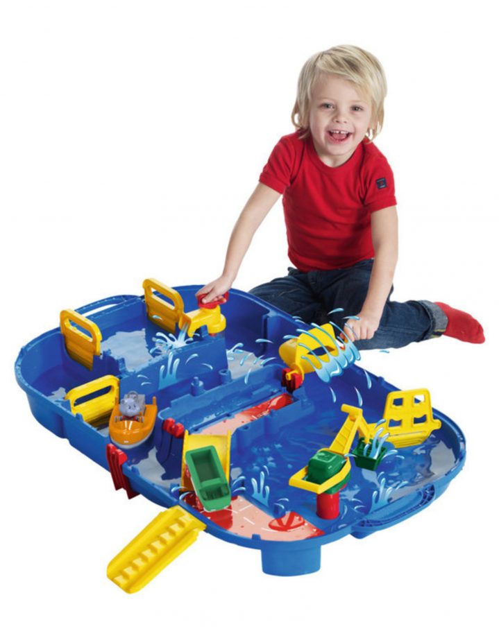 Child playing with a water toy for three year olds.