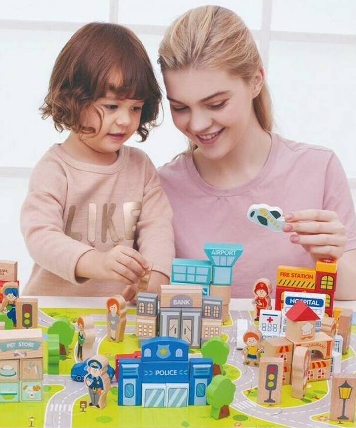 A mother and son playing with city Building Blocks