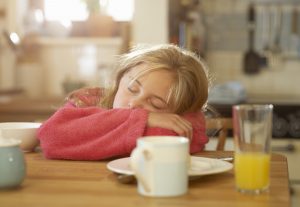 child suffering with fatigue, one of the symptoms of long covid in kids