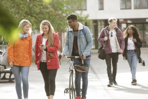 students on results day walking - UCAS Track results day