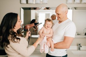 Mum and dad and baby with hairdryer from Tesco Black Friday 2020