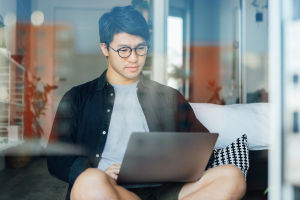 Man working from home on laptop during localised lockdown