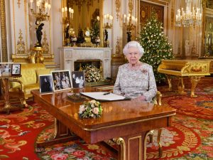 The Queen in Sandringham with pictures of the royal family on Christmas Day