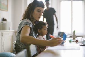 woman and child at home under self isolation rules in the UK