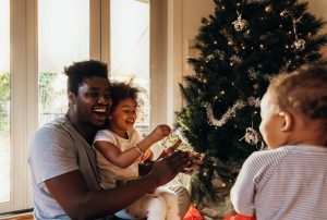 family around the Christmas tree under new Christmas lockdown rules