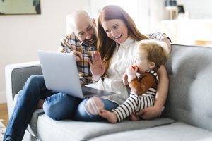 Family using laptop to video chat during lockdown
