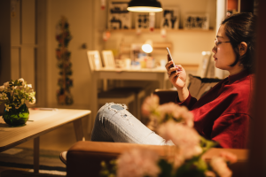 woman researching whether lockdown will be extended over Christmas