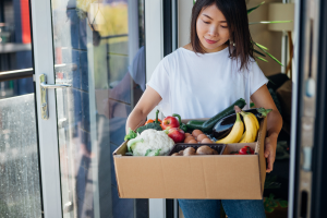 woman accepting supermarket deliveries