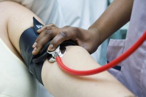 blood pressure being read with a sphygmomanometer