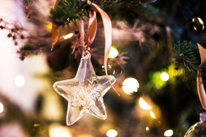 decorative Christmas ornament of a glass star on Christmas tree