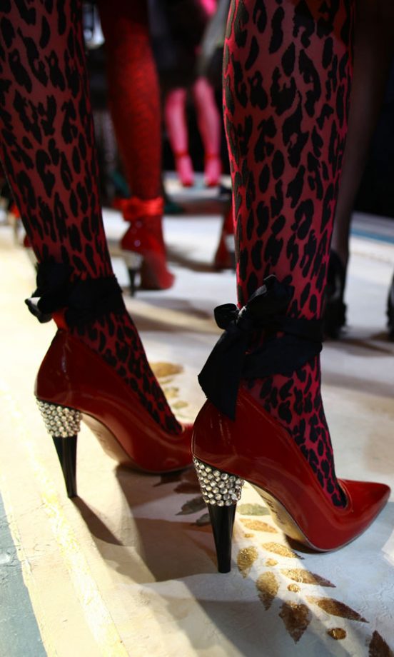 The Covetable Lanvin For H&M Red Heels With Black Ribbon Tie And Bejewelled Heel At The Lanvin For H&M Haute Couture New York Fashion Show 2010