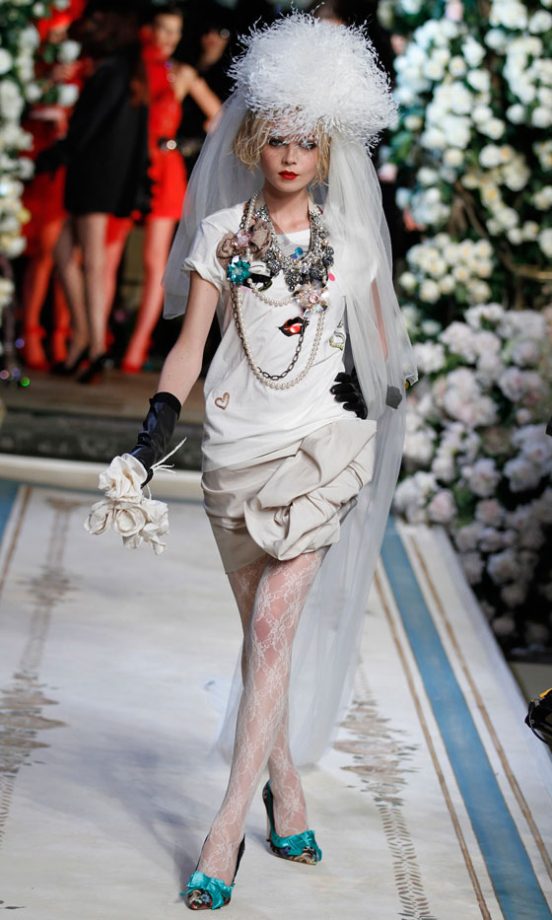 A Model Wearing A Face Print T-Shirt With A White Ruffled Skirt At The Lanvin For H&M Haute Couture New York Fashion Show 2010