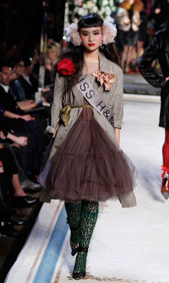 A Model Wearing A Grey Tulle Dress With Green Leopard Print Tights At The Lanvin For H&M Haute Couture New York Fashion Show 2010