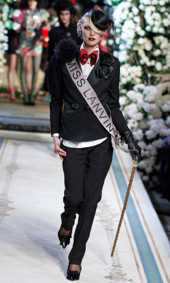 A Model With A Miss Lanvin Sash Wearing A Classic Black Blazer At The Lanvin For H&M Haute Couture New York Fashion Show 2010