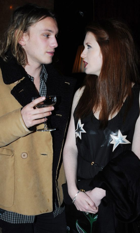 Bonnie Wright Catches Up On The Latest Gossip With Jamie Campbell Bower At The Miu Miu London Store Opening Party 2010