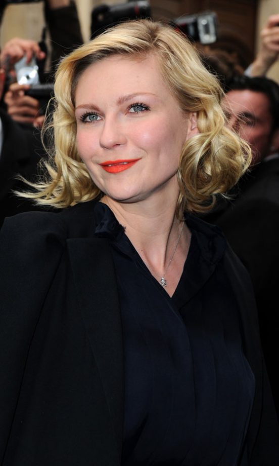 Kirsten Dunst Adds Colour With Tangerine Lipstick At The Chanel Haute Couture SS11 Show In Paris, 2011