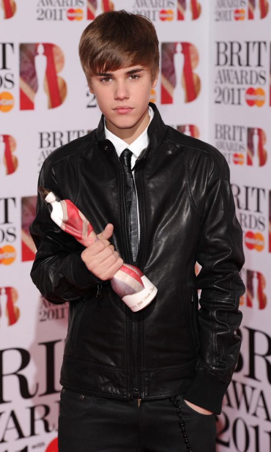 Justin Beiber With His Best International Act Award At The Brit Awards 2011
