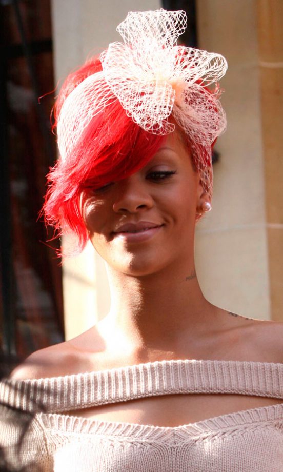 Rihanna Stands Out From The Crowd Wearing A Pale Pink Netted Bow Hair Accessory In Paris, October 2010