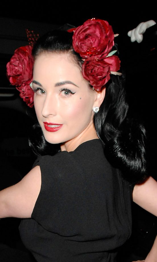 Dita Von Teese Compliments Her Lips With A Rose Hair Accessory In New York, 2007