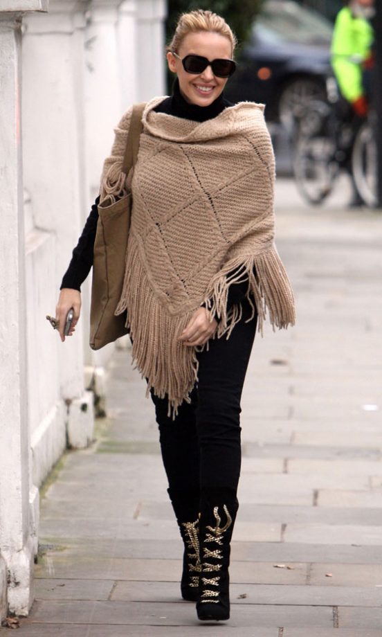 Fierce Ankle Boots Add A Touch Of Glam To Her Casual Poncho, 2011