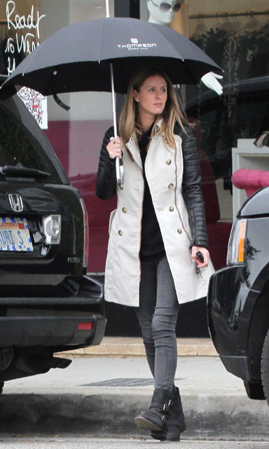 Even In The Pouring Rain, Nicky Hilton Manages To Look Cool In A Leather Sleeve Trench Coat By Burberry, 2011