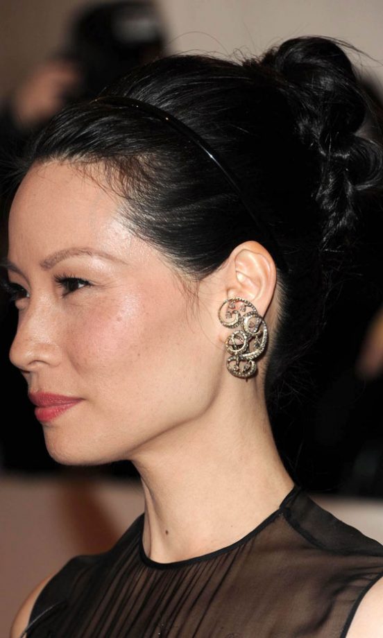 Lucy Liu Adds Breakfast At Tiffany's Sophistication To Her Bun Hairstyle With A Simple Hairband, 2011