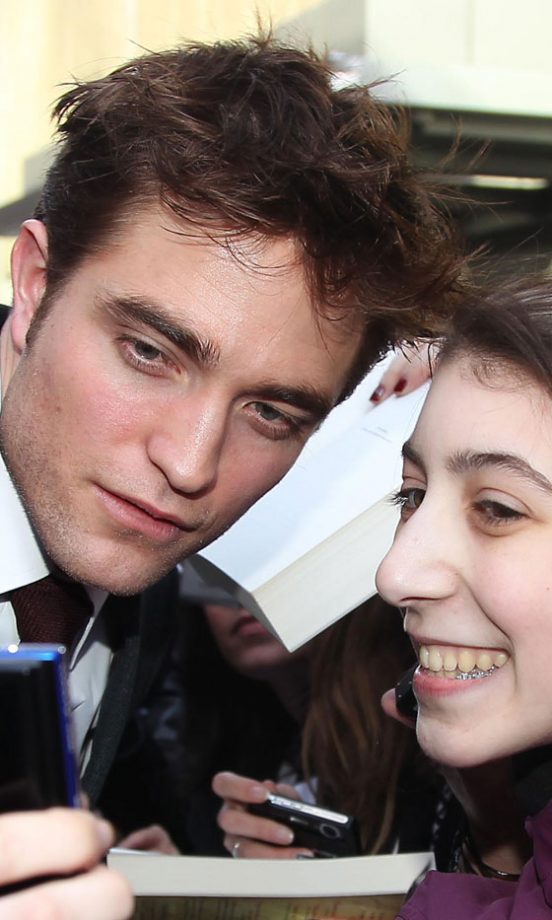 Robert Pattinson Poses With A Fan At The New York Film Premiere Of Water For Elephants, 2011