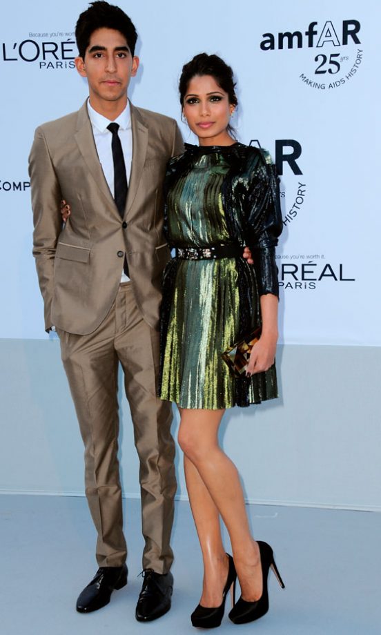 Freida Pinto With Dev Patel At The AmfAR Gala During Cannes Film Festival 2011