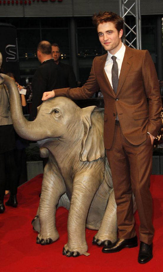 Robert Pattinson Poses With An Elephant Statue In Berlin At The Water For Elephants Premiere, April 2011