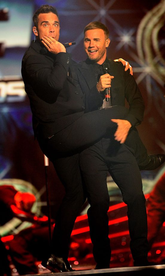 Robbie Williams And Gary Barlow On Stage At The National Movie Awards 2011